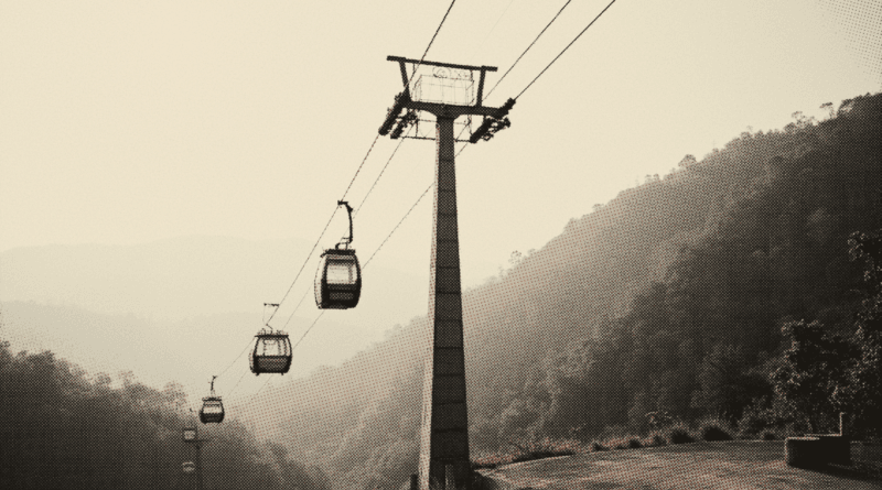 A cable-car pylon standing on a forested hillside against open morning sky — Genting SkyWorlds Ticket Price 2026: Vs Skytropolis & VQ Guide