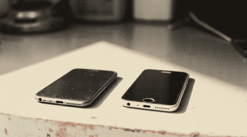 Two mobile phones lying face down side by side on a plain table — iPhone 17 Pro Max vs Samsung S26 Ultra for Malaysia 2026