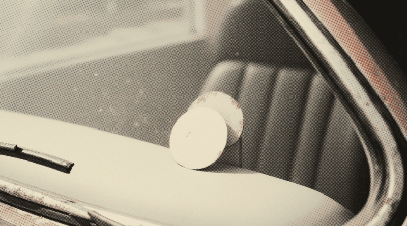 The inside top corner of a car windscreen seen from within the cabin — Road Tax Malaysia 2026: Price List by Engine CC
