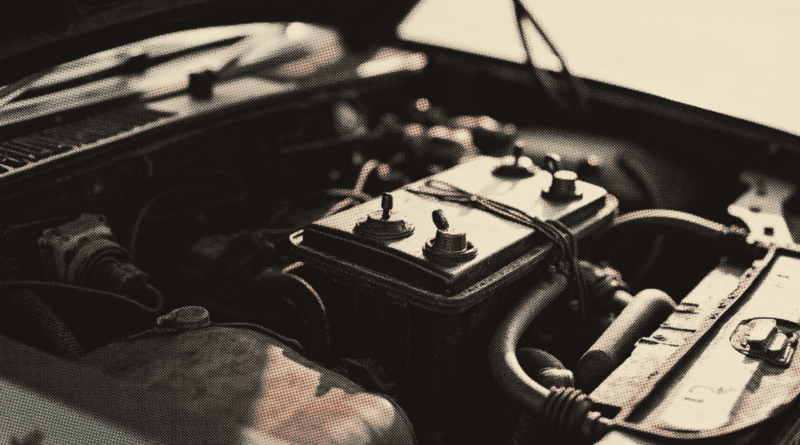 An open car bonnet seen from above in morning light — Car Battery Price Malaysia 2026: Century vs Amaron