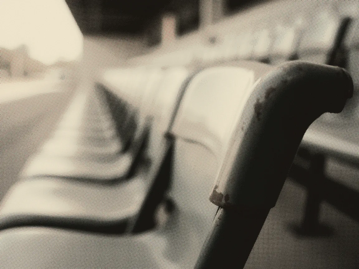 Concert Malaysia 2026: Guide to Tickets, Seating & Beating Scalpers — the arm of an empty folding stadium seat with chipped paint