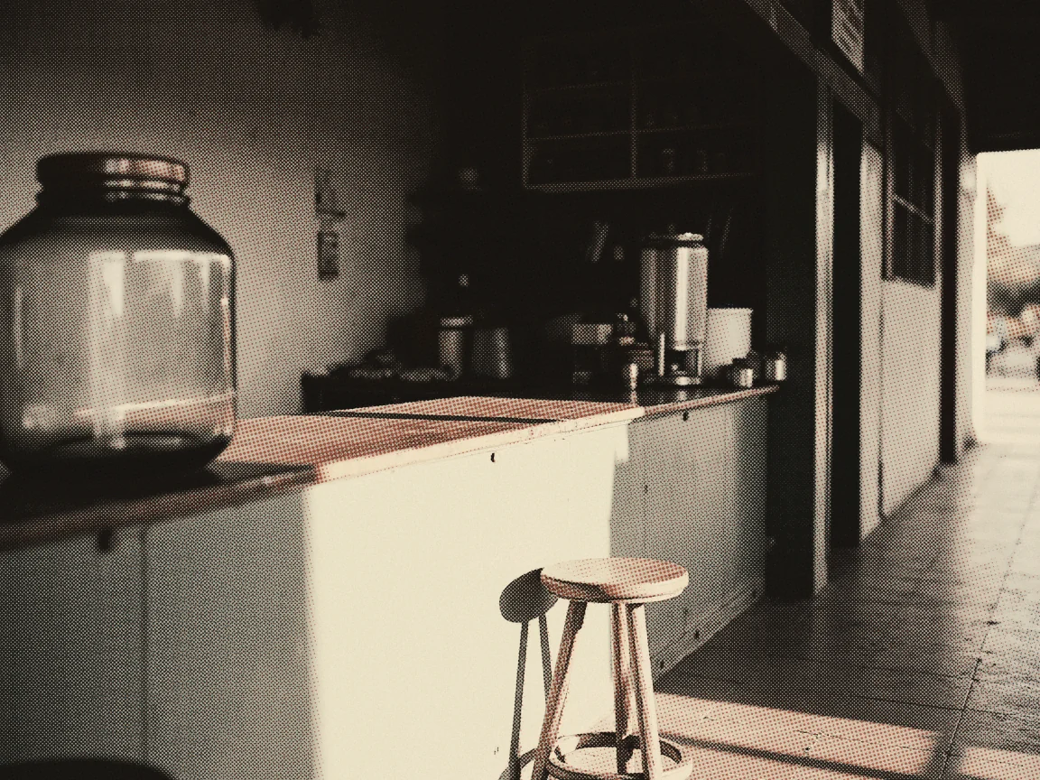 e-Invoice Malaysia 2026: What Individuals Need to Know — an empty kopitiam counter with a glass jar and a wooden stool, morning light down the corridor
