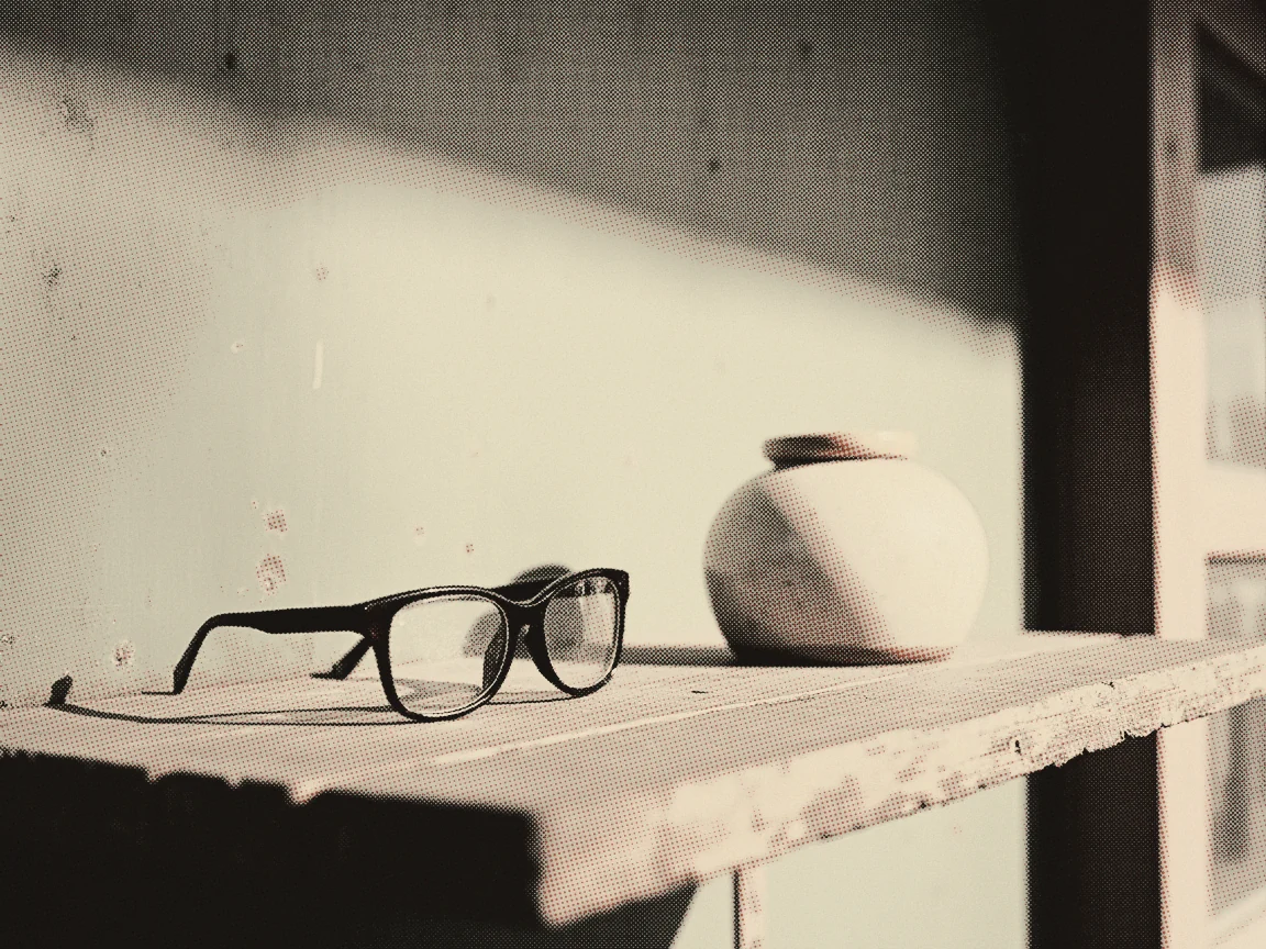 EPF Dividend Rate: Latest Declared Rate & Payout History — a rounded coin jar and folded spectacles on a bare timber table
