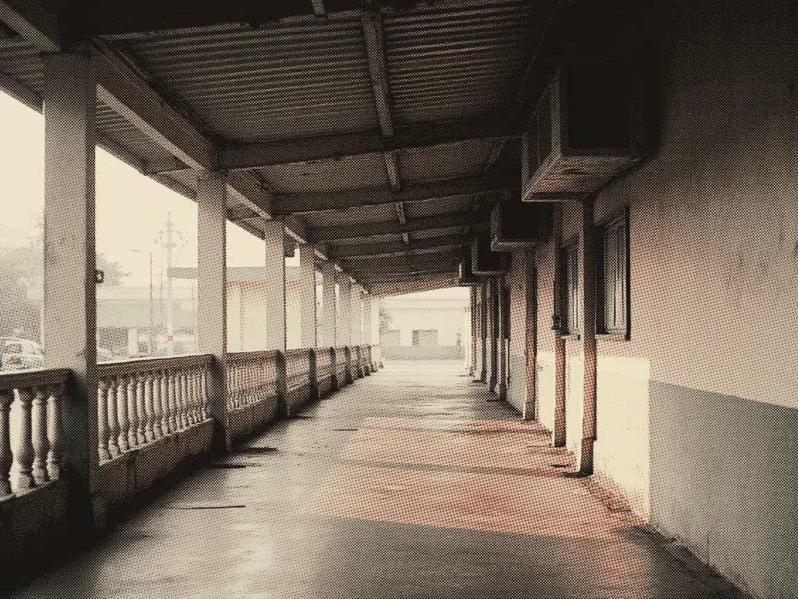 Genting SkyWorlds Ticket Price 2026: Vs Skytropolis & VQ Guide — an empty outdoor queue lane between painted steel railings