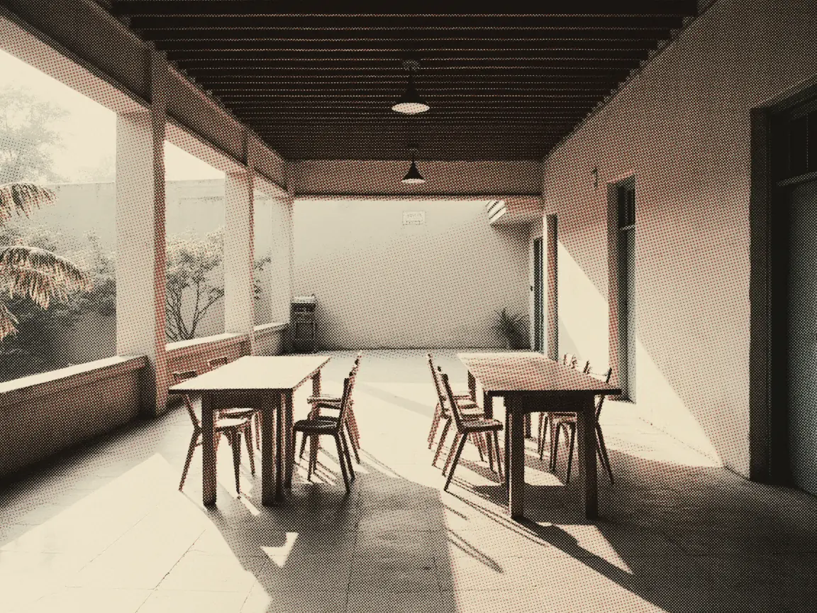 Labour Department Complaint Malaysia 2026: Which Door — an empty covered walkway with rows of tables and chairs, morning light along the corridor