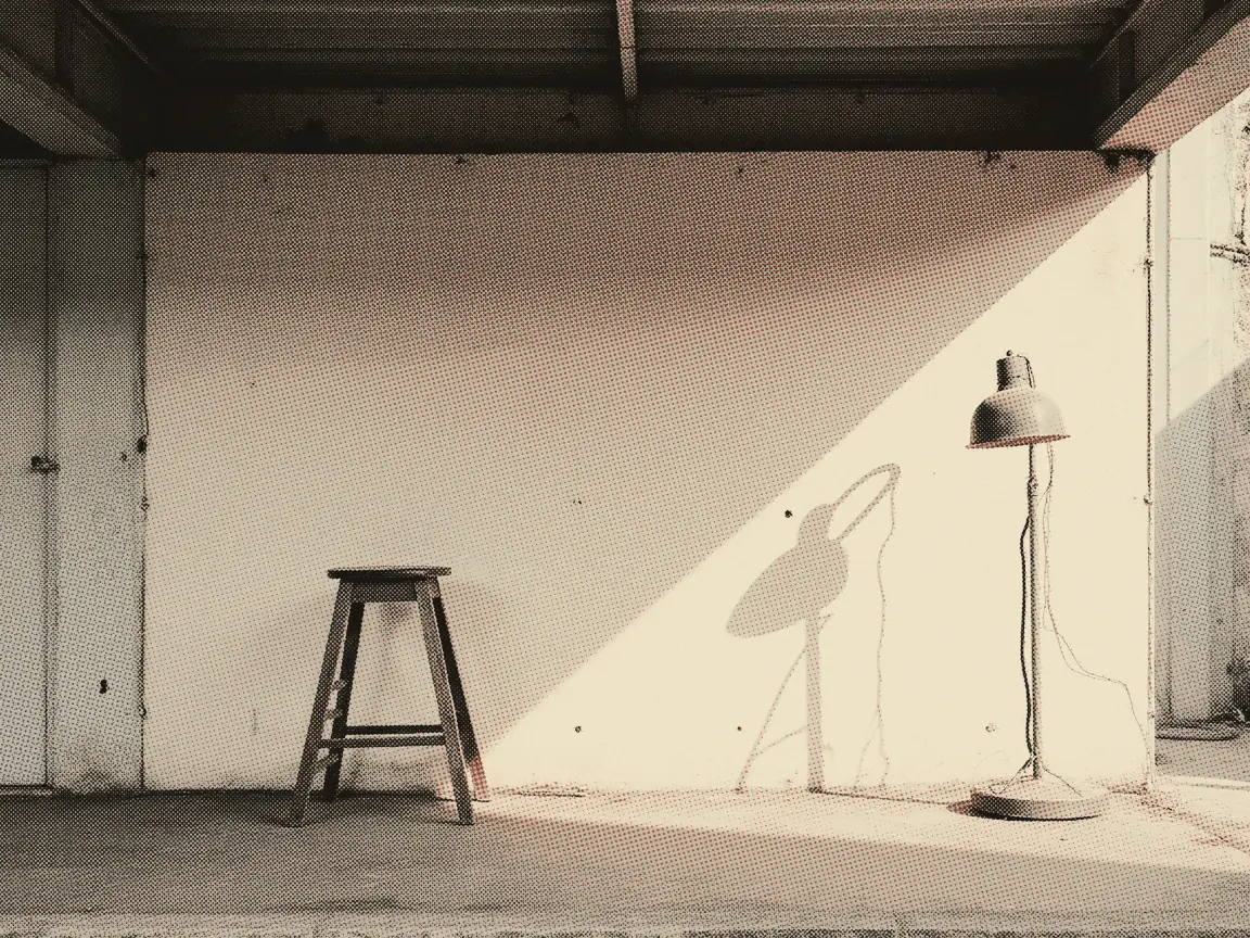 MyDigital ID 2026: How to Register & Link JPJ/LHDN Services — a stool set in front of a completely bare pale wall with a lamp