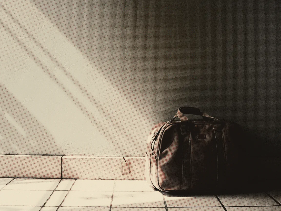 Passport Renewal Malaysia 2026: Online Steps & Price — the handle of a travel bag with a blank luggage tag beside it