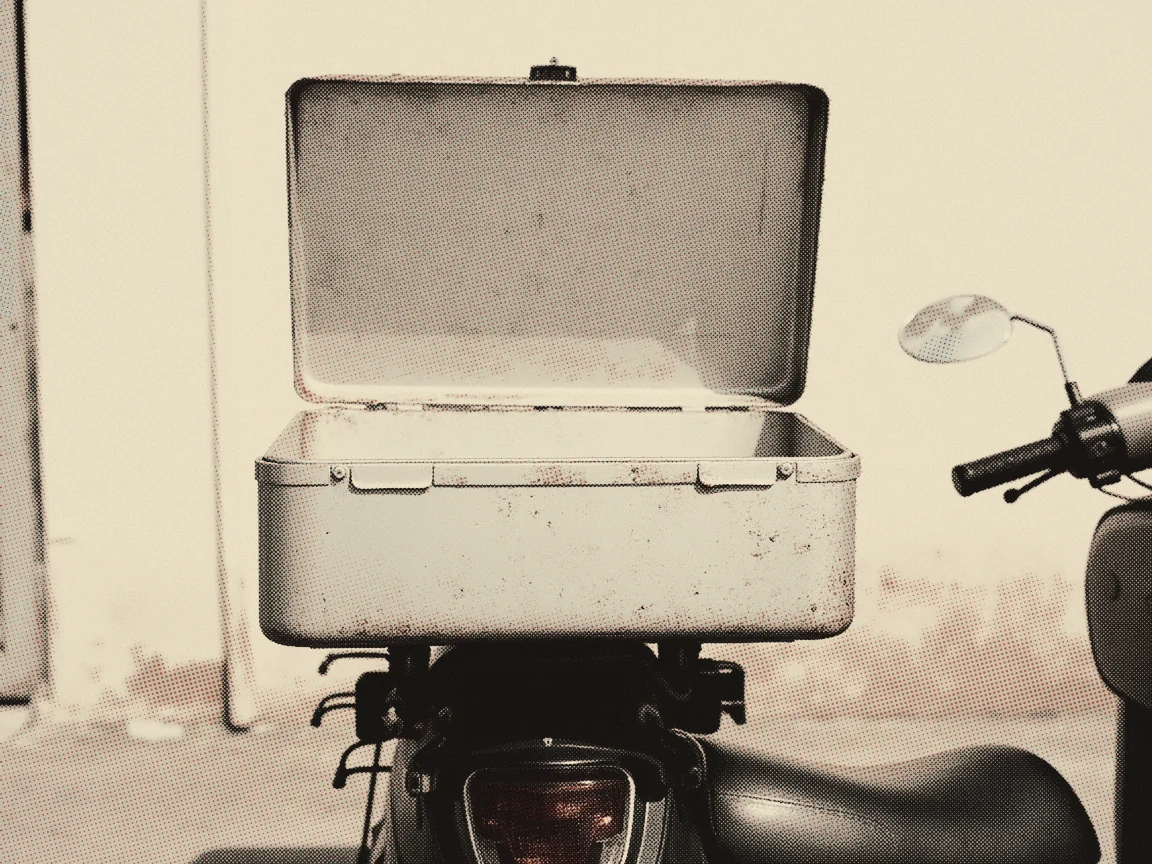 Self-Employed SOCSO Malaysia 2026: SKSPS Plans, Claims — an open delivery box mounted on the back of a motorcycle