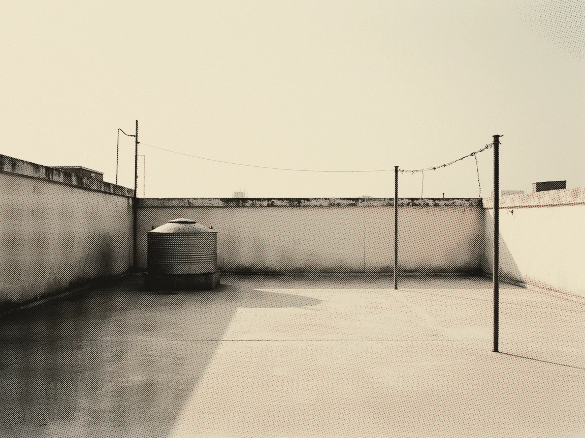 Strata Maintenance Fee Malaysia 2026: JMB, MC, Tribunal — an empty apartment rooftop with a water tank and bare laundry lines